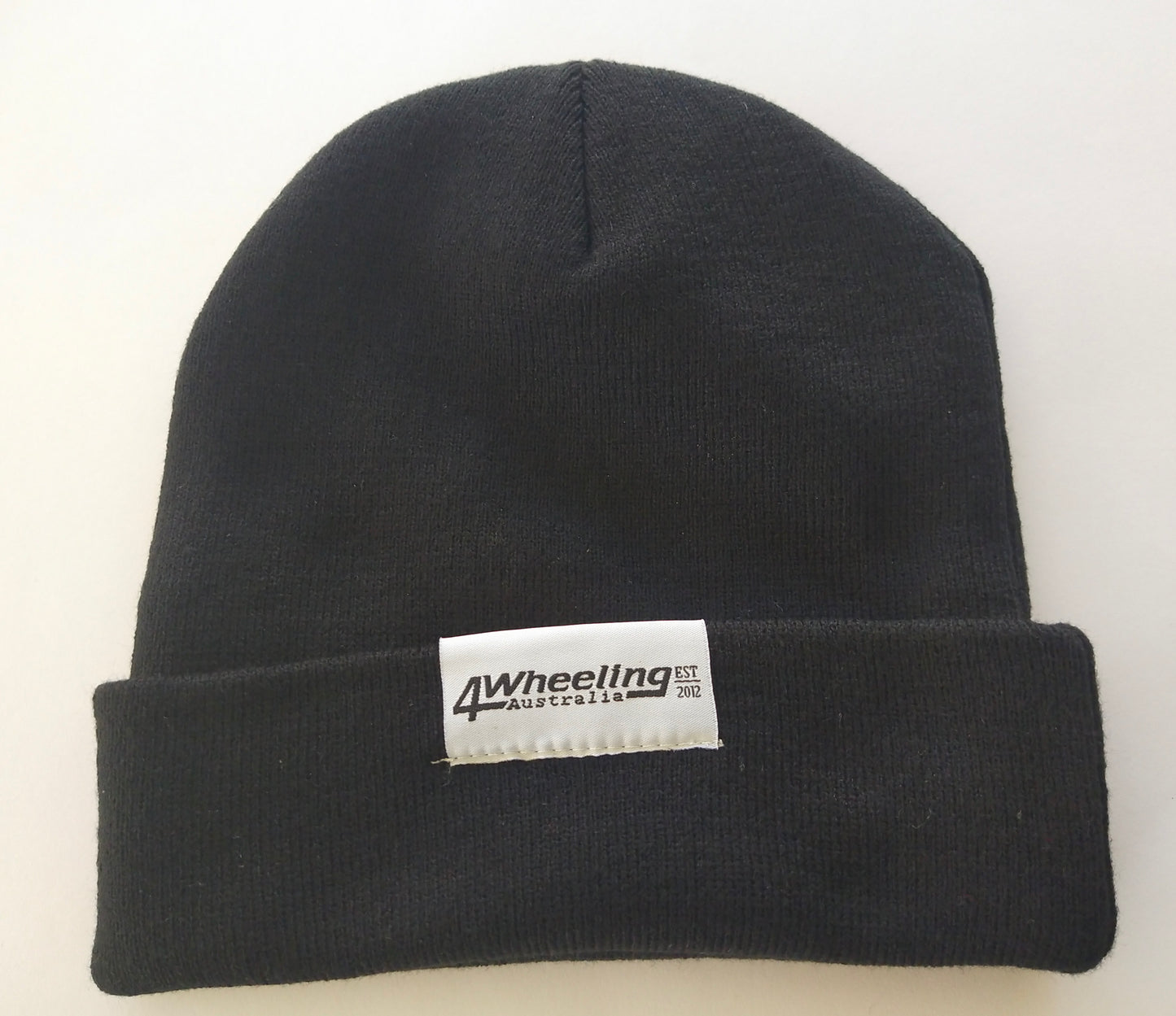 Beanie with 4 Wheeling Australia woven label patch logo.