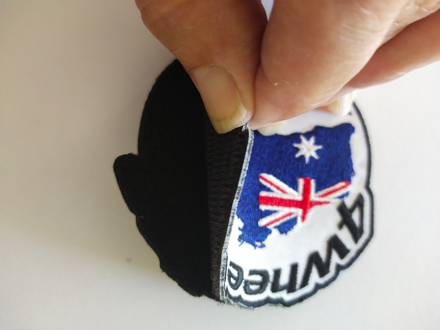 White Round Patch With 4 Wheeling Australia Logo.